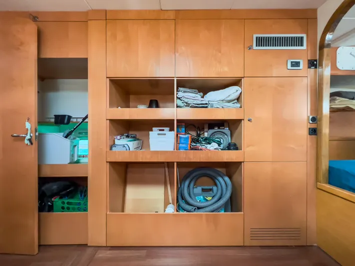 Stella Maris Yacht Photos Pics Interior storage of 2008 Fountaine Pajot Eleuthera 60 catamaran with organized shelves and equipment.