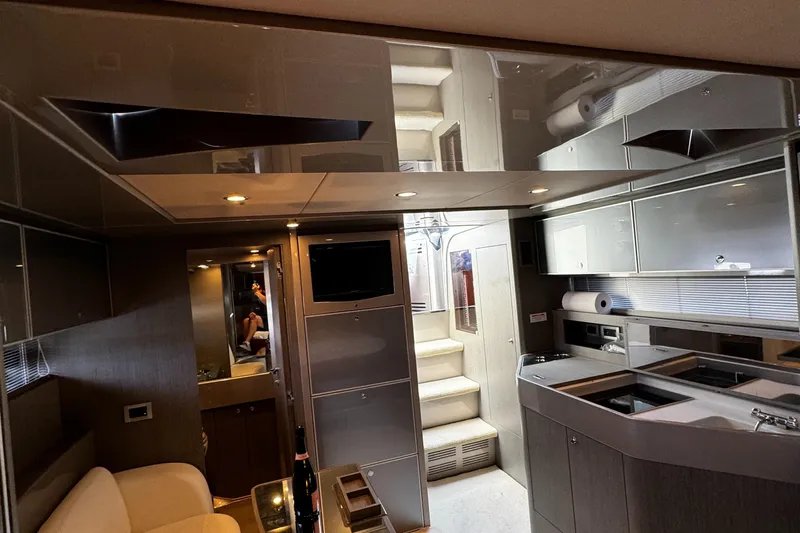 Sea Sea Yacht Photos Pics Luxurious interior of a 2013 Riva Rivarama Super yacht with modern kitchen and seating area.