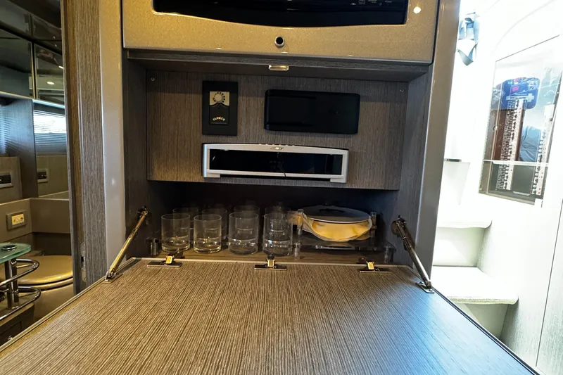 Sea Sea Yacht Photos Pics 2013 Riva Rivarama Super yacht interior with bar setup and glassware.