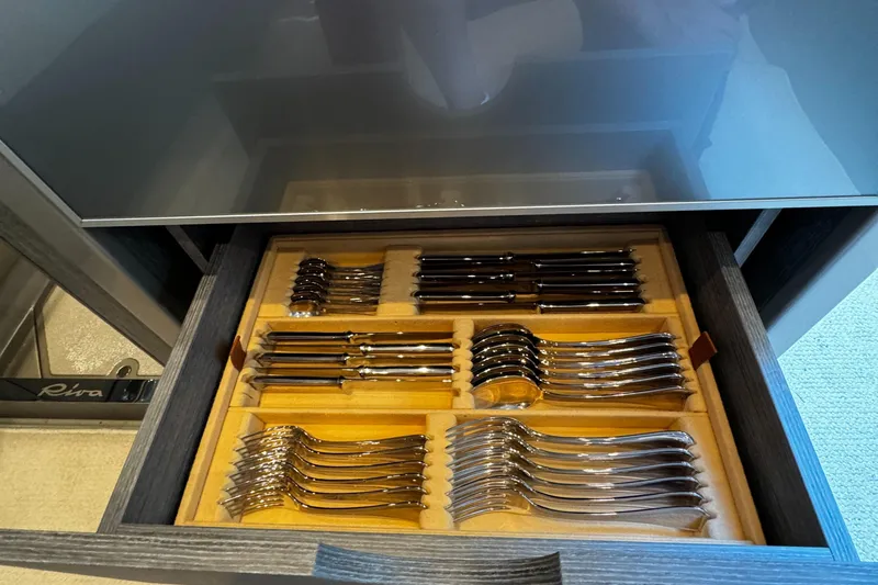 Sea Sea Yacht Photos Pics Drawer with neatly organized silverware set in a 2013 Riva Rivarama Super yacht.