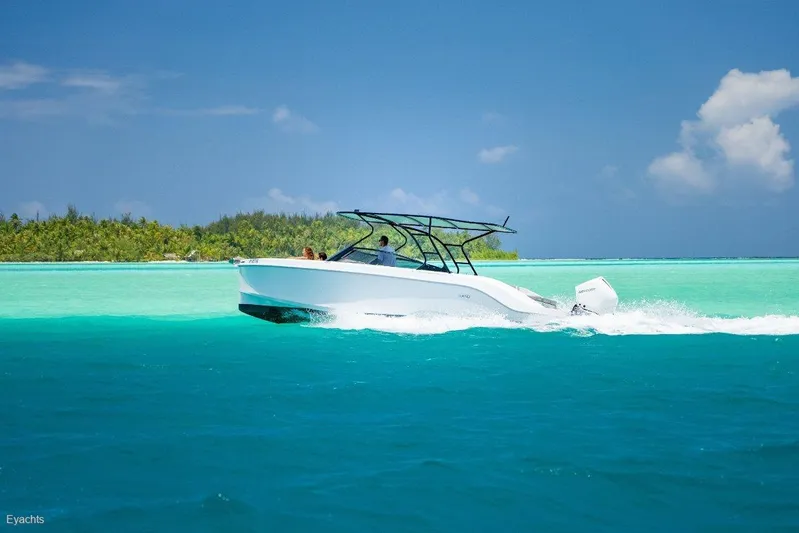  Yacht Photos Pics Modern Rand Supreme 27 boat cruising in turquoise waters, 2025 model.