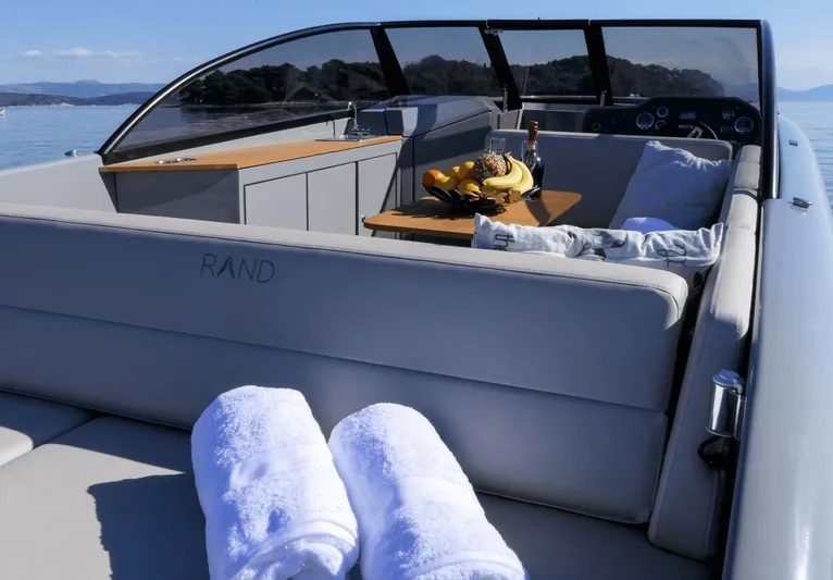  Yacht Photos Pics Luxurious Rand Supreme 27 yacht interior with towels and refreshments, 2025 model.