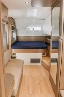 Yacht Photos Pics Interior of 2022 Bali 4.6 Open Space yacht with cozy bed and seating area.
