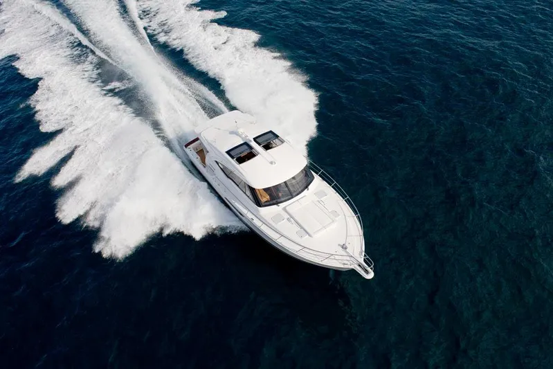 Eagle Yacht Photos Pics 2016 Riviera 525 SUV cruising on open water, aerial view.