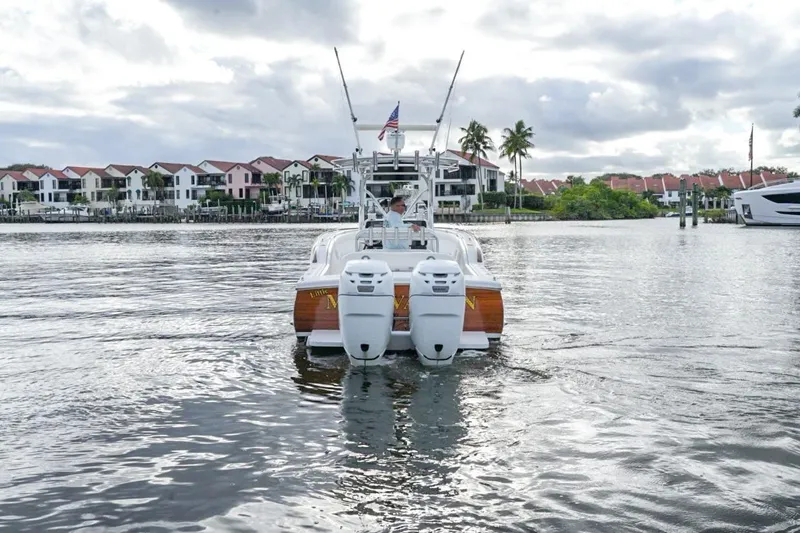  Yacht Photos Pics 2008 Buddy Davis 28 Center Console boat cruising on a scenic waterfront.
