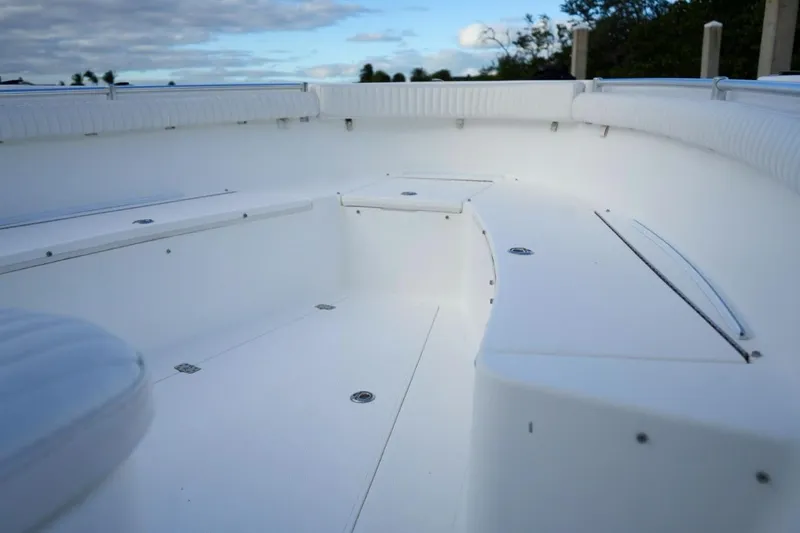  Yacht Photos Pics 2008 Buddy Davis 28 Center Console boat interior with white seating and storage compartments.