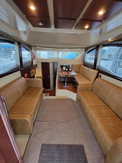  Yacht Photos Pics Luxurious interior of 2007 Sea Ray 360 Sedan with plush seating and dining area.