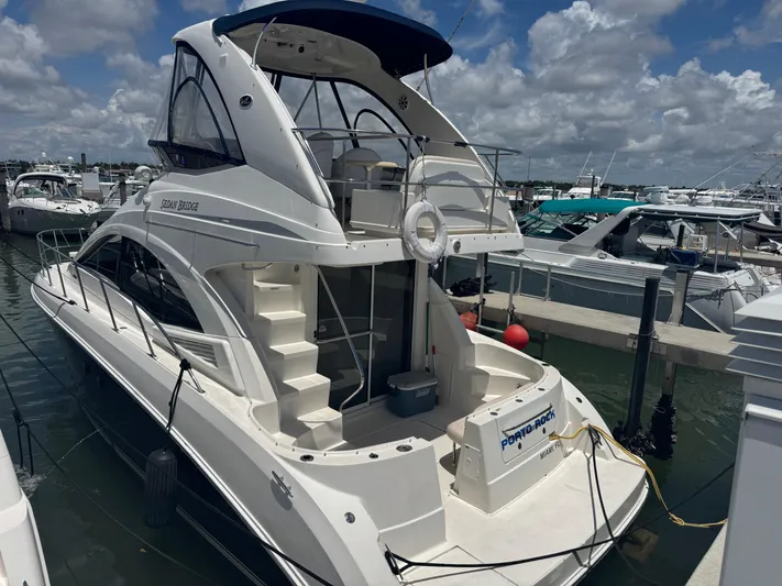  Yacht Photos Pics 2007 Sea Ray 360 Sedan yacht docked at marina under cloudy sky.