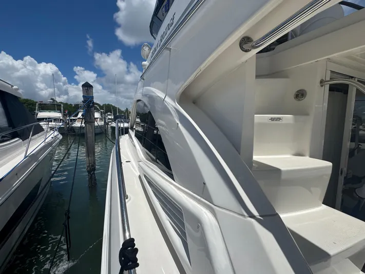  Yacht Photos Pics 2007 Sea Ray 360 Sedan yacht docked at marina under clear blue sky.