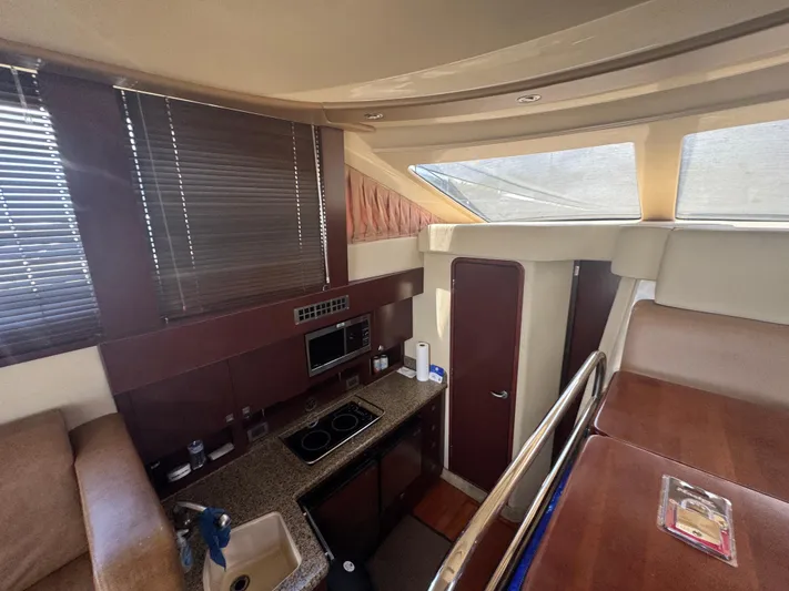  Yacht Photos Pics Interior of 2007 Sea Ray 360 Sedan yacht with kitchen and seating area.