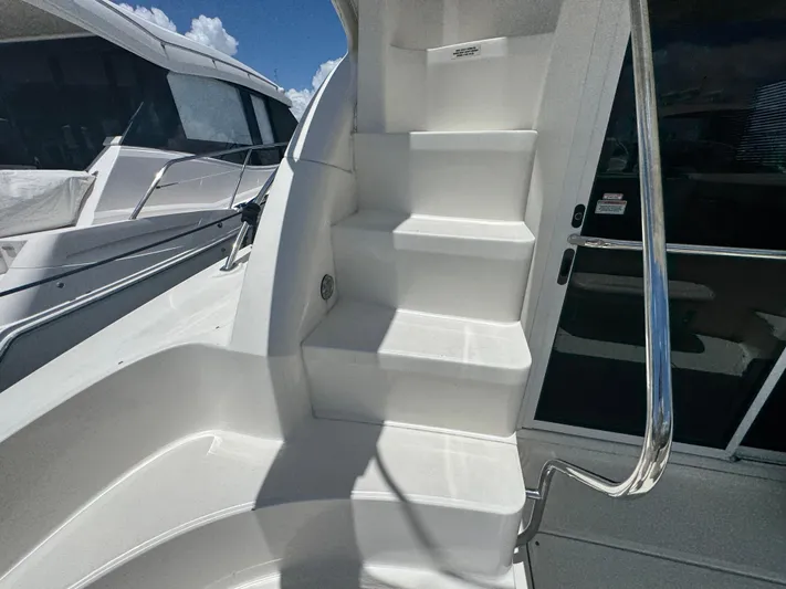  Yacht Photos Pics Staircase on a 2007 Sea Ray 360 Sedan yacht, featuring sleek white design and stainless steel railing.