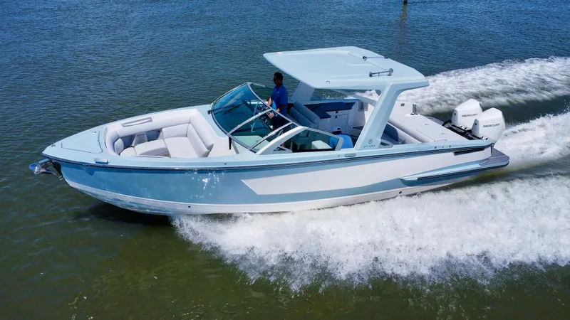  Yacht Photos Pics 2021 Aviara AV32 OB luxury motorboat cruising on water.