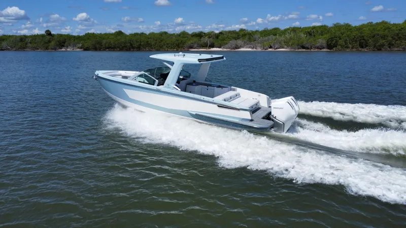  Yacht Photos Pics 2021 Aviara AV32 OB boat cruising on a lake.