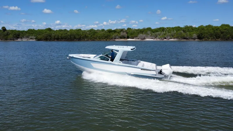  Yacht Photos Pics 2021 Aviara AV32 OB cruising on a calm lake.