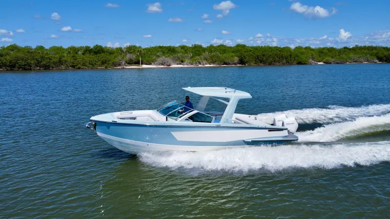  Yacht Photos Pics 2021 Aviara AV32 OB cruising on a sunny day in a scenic waterway.