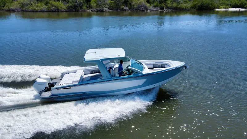  Yacht Photos Pics 2021 Aviara AV32 OB boat cruising on a calm lake.