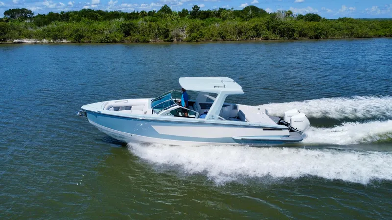  Yacht Photos Pics 2021 Aviara AV32 OB boat cruising on a scenic waterway.