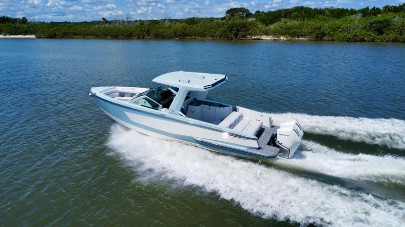  Yacht Photos Pics 2021 Aviara AV32 OB boat cruising on a scenic lake.