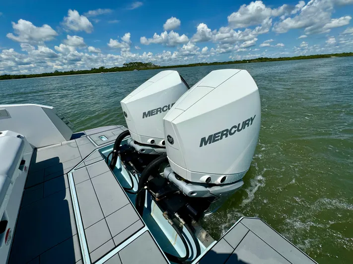  Yacht Photos Pics 2021 Aviara AV32 OB with twin Mercury outboard engines on a lake.