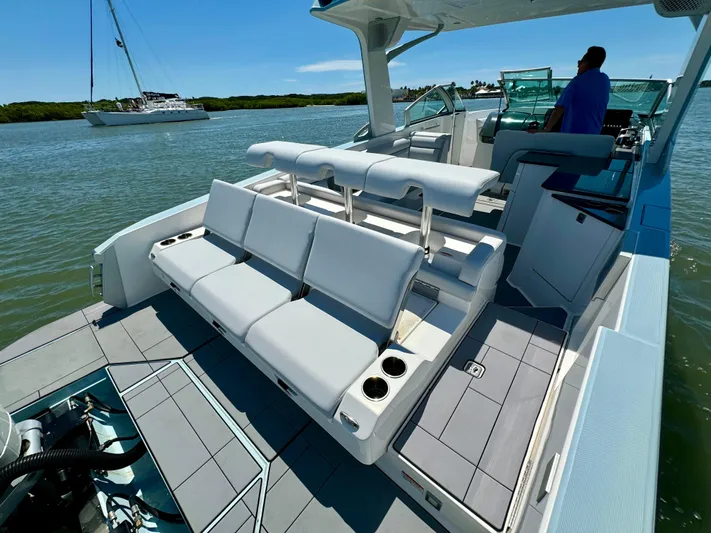  Yacht Photos Pics 2021 Aviara AV32 OB luxury boat with spacious seating and modern design on the water.