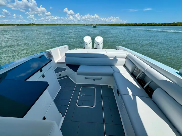  Yacht Photos Pics 2021 Aviara AV32 OB boat interior with spacious seating and scenic water view.