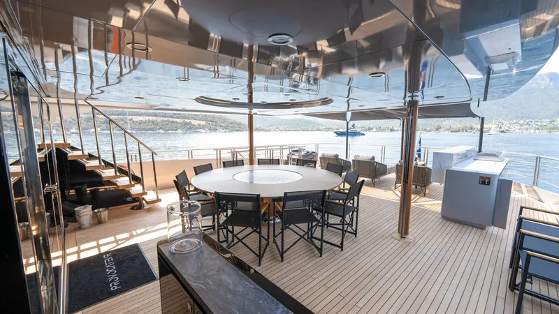 Provocateur Yacht Photos Pics Luxurious Mondomarine 50 Meters yacht deck, 2016 model, featuring elegant outdoor seating and dining area.