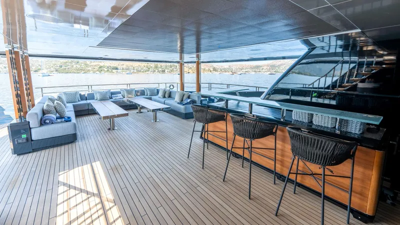 Provocateur Yacht Photos Pics Luxurious Mondomarine 50 Meters yacht deck with seating and bar, 2016 model.