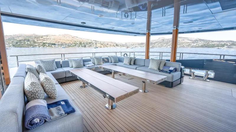 Provocateur Yacht Photos Pics Luxurious Mondomarine 50 Meters yacht deck with elegant seating, scenic water view, built in 2016.