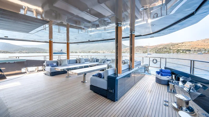 Provocateur Yacht Photos Pics Luxurious Mondomarine 50 Meters yacht deck, 2016 model, with elegant seating and scenic views.