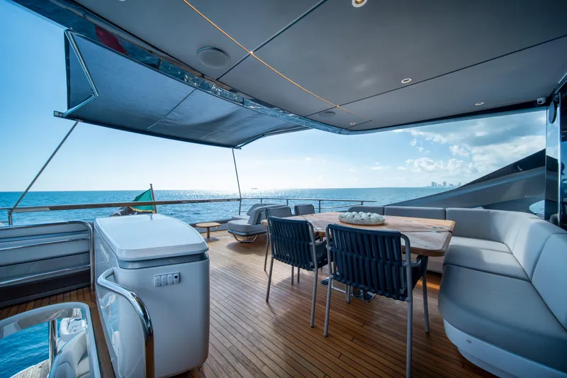 Maravi Yacht Photos Pics Luxurious 2025 Princess X80 yacht deck with ocean view and elegant seating area.