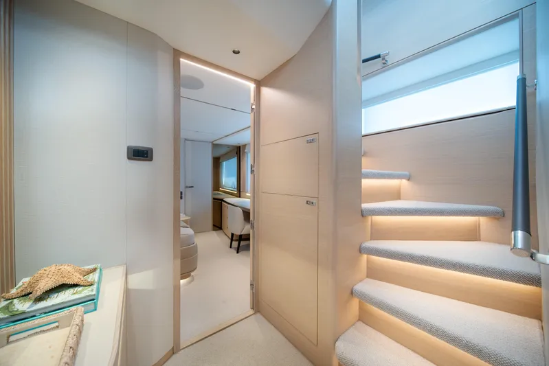 Maravi Yacht Photos Pics Luxurious interior of 2025 Princess X80 yacht with elegant staircase and modern design.