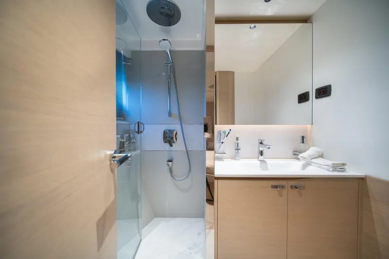 Maravi Yacht Photos Pics Luxurious bathroom in 2025 Princess X80 yacht with modern shower and sleek vanity.