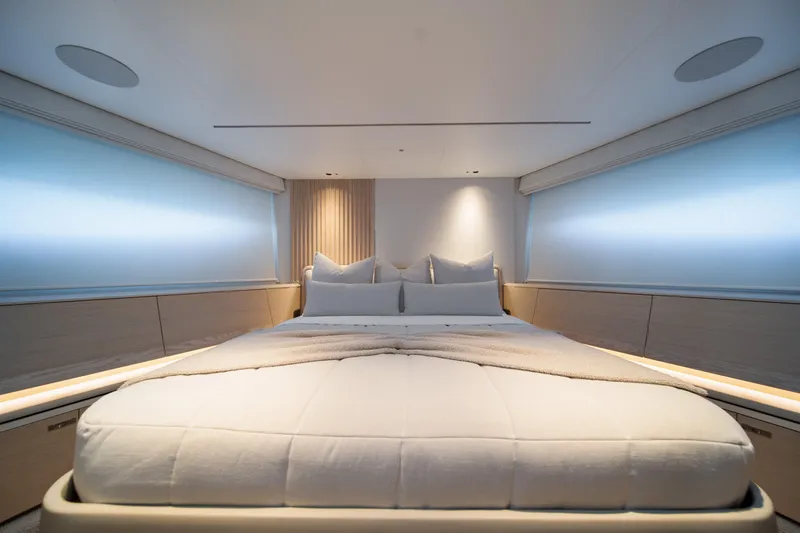 Maravi Yacht Photos Pics Luxurious bedroom interior of 2025 Princess X80 yacht, featuring elegant design and soft lighting.