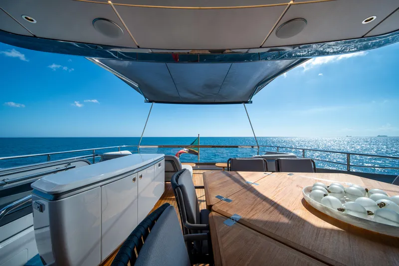 Maravi Yacht Photos Pics Luxurious 2025 Princess X80 yacht deck with ocean view and elegant seating area.