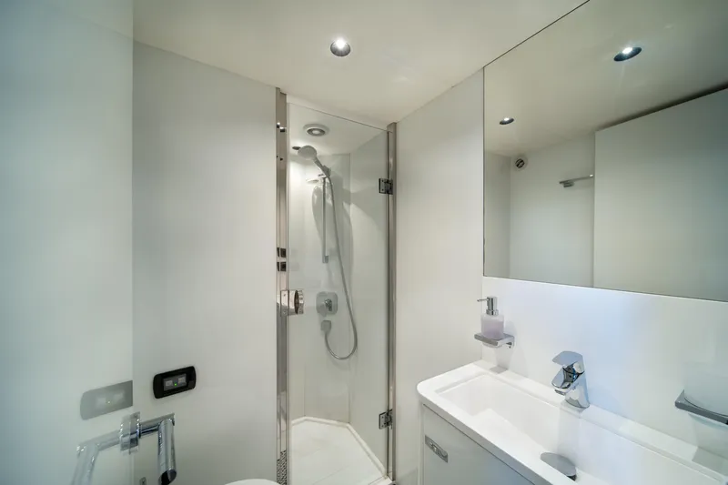 Maravi Yacht Photos Pics Modern bathroom in 2025 Princess X80 yacht with sleek shower and vanity.