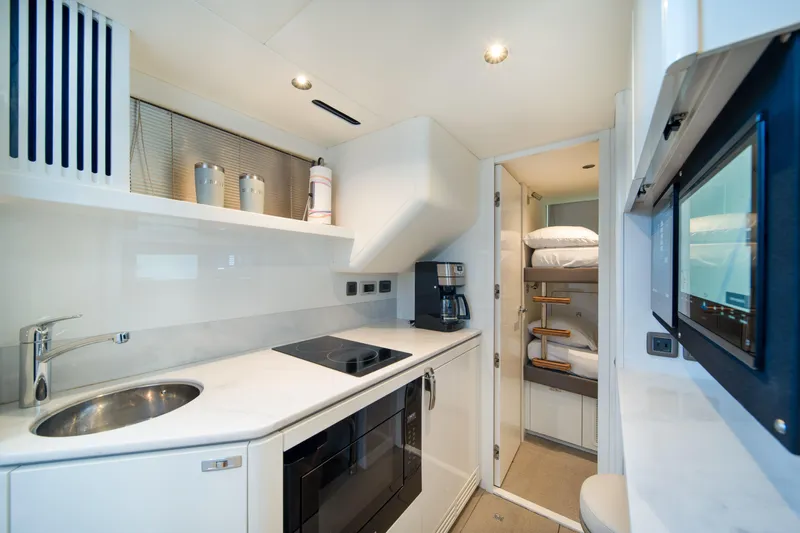 Maravi Yacht Photos Pics Modern kitchen and bunk area in 2025 Princess X80 yacht.