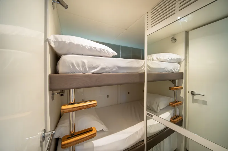 Maravi Yacht Photos Pics Bunk beds in the 2025 Princess X80 yacht cabin, featuring modern design and comfort.