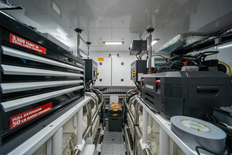 Maravi Yacht Photos Pics Engine room of 2025 Princess X80 yacht with toolboxes and equipment.