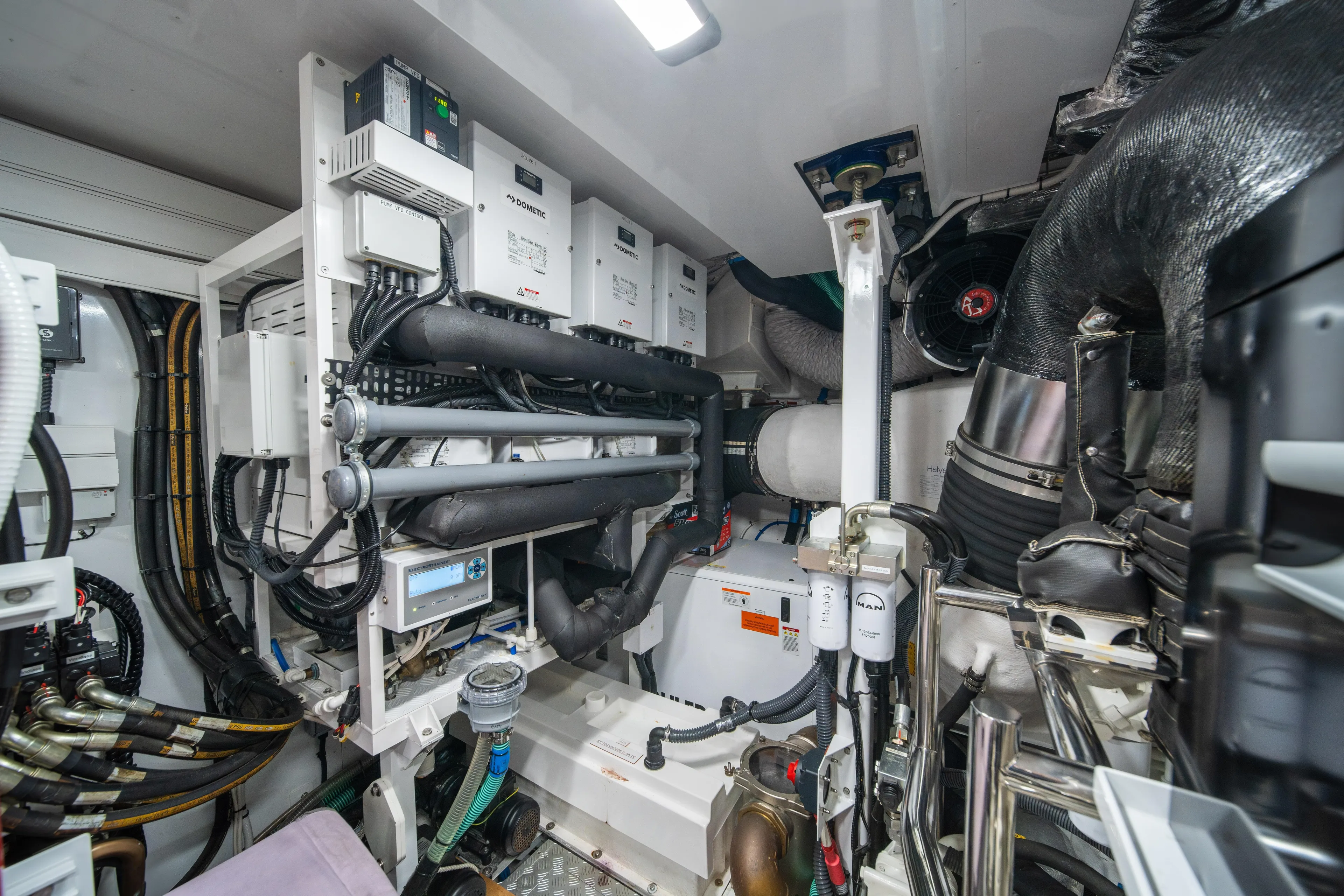 Maravi Yacht Photos Pics Engine room of 2025 Princess X80 yacht, showcasing advanced machinery and piping systems.