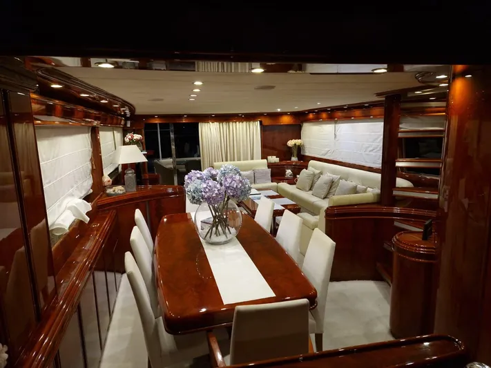  Yacht Photos Pics Luxurious interior of 2000 Astondoa 82 GLX yacht with elegant dining and seating area.