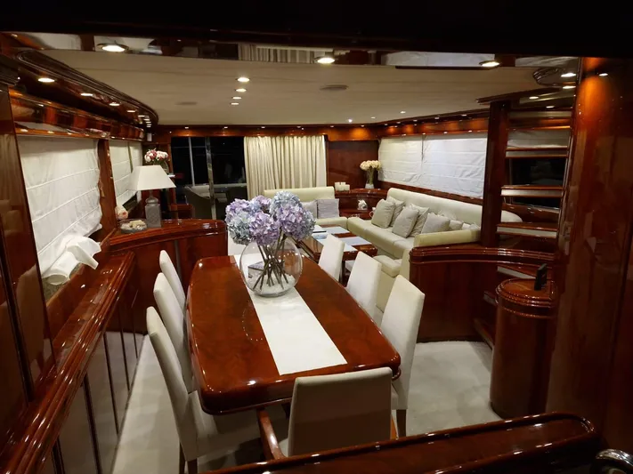  Yacht Photos Pics Luxurious interior of 2000 Astondoa 82 GLX yacht with elegant dining and seating area.