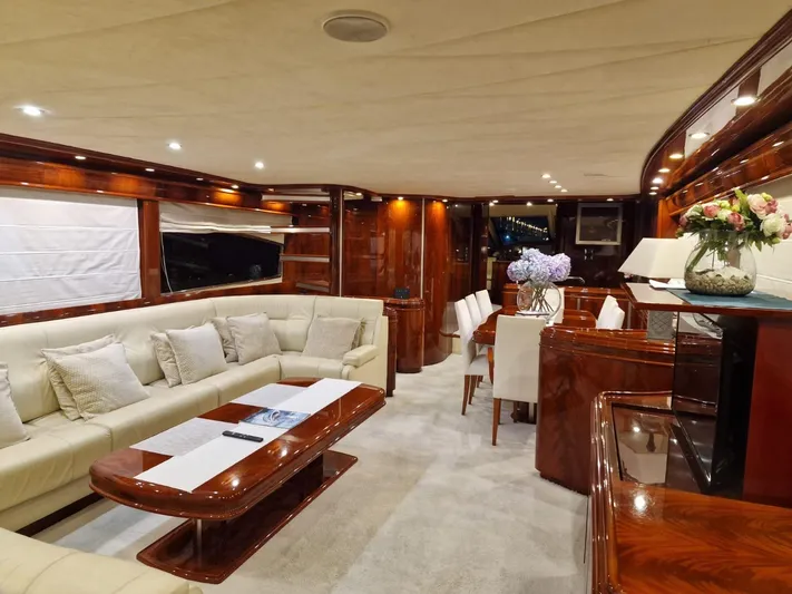  Yacht Photos Pics Luxurious interior of 2000 Astondoa 82 GLX yacht with elegant wood finishes and plush seating.