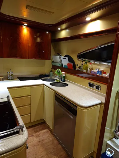  Yacht Photos Pics Luxurious kitchen interior of 2000 Astondoa 82 GLX yacht with modern amenities.