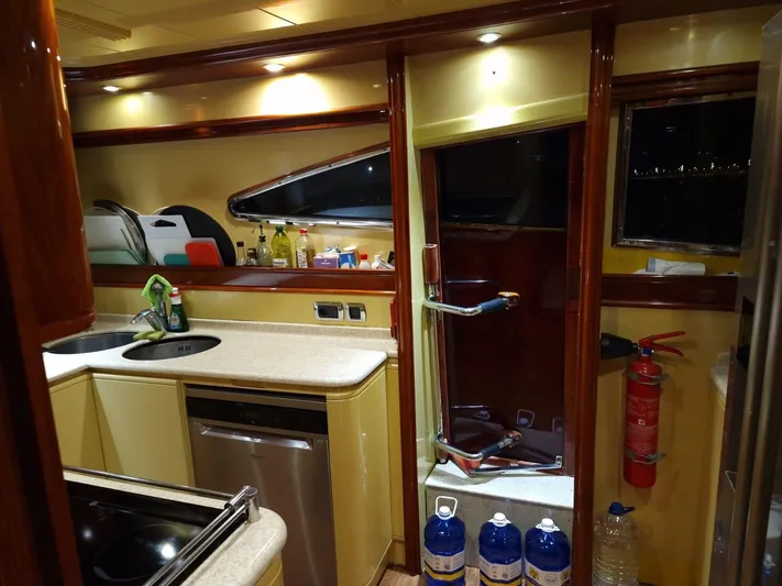  Yacht Photos Pics Luxurious kitchen interior of 2000 Astondoa 82 GLX yacht with modern amenities.