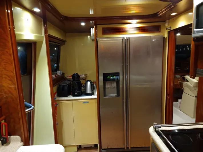  Yacht Photos Pics Luxurious kitchen interior of 2000 Astondoa 82 GLX yacht with modern appliances.