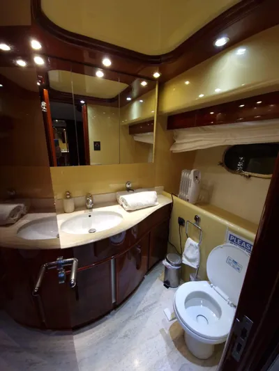  Yacht Photos Pics Luxurious bathroom in 2000 Astondoa 82 GLX yacht with elegant fixtures and dual sinks.