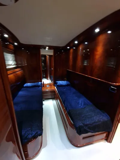  Yacht Photos Pics Luxurious cabin interior of 2000 Astondoa 82 GLX yacht with twin beds and elegant wood finish.
