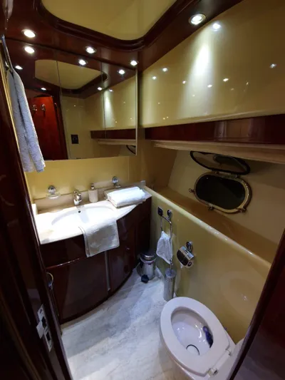  Yacht Photos Pics Luxurious bathroom in 2000 Astondoa 82 GLX yacht with elegant fixtures and lighting.