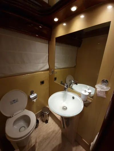  Yacht Photos Pics Luxurious bathroom in 2000 Astondoa 82 GLX yacht with modern fixtures and elegant lighting.
