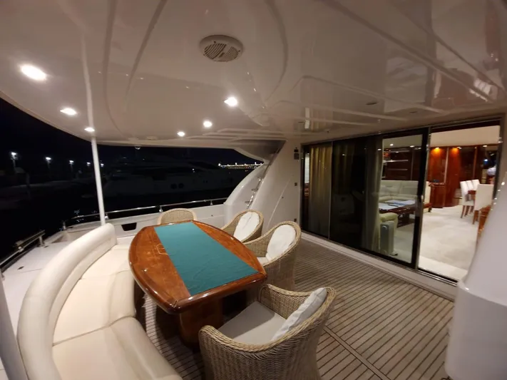  Yacht Photos Pics Luxurious Astondoa 82 GLX yacht deck with elegant seating and dining area, 2000 model.